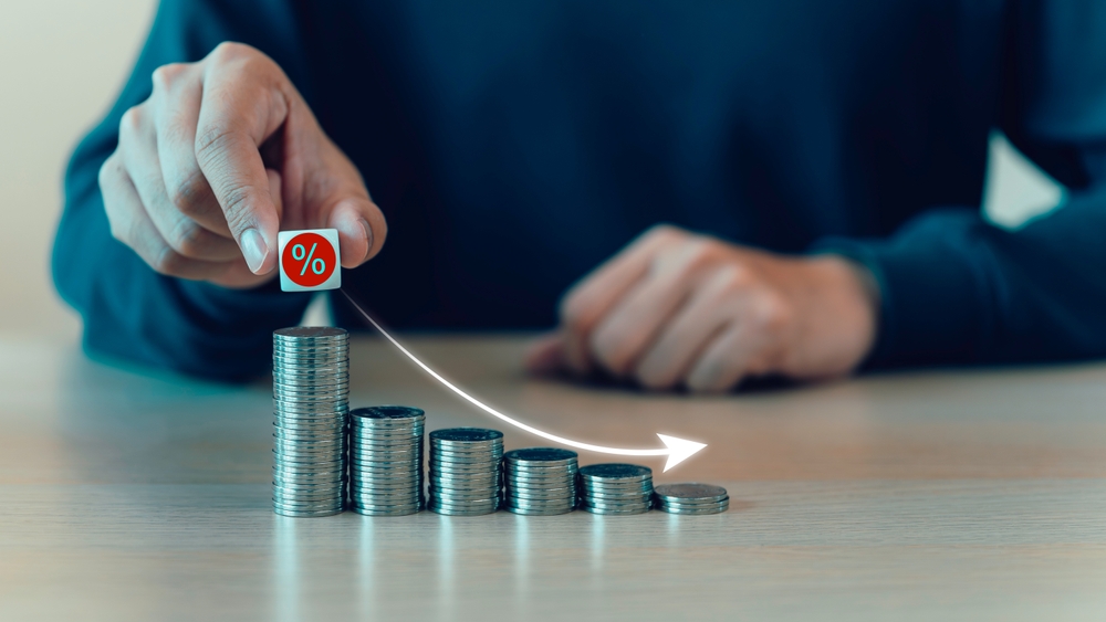 Percent,Sign,Moving,Down,From,Top,On,Coin,Stack.,Central